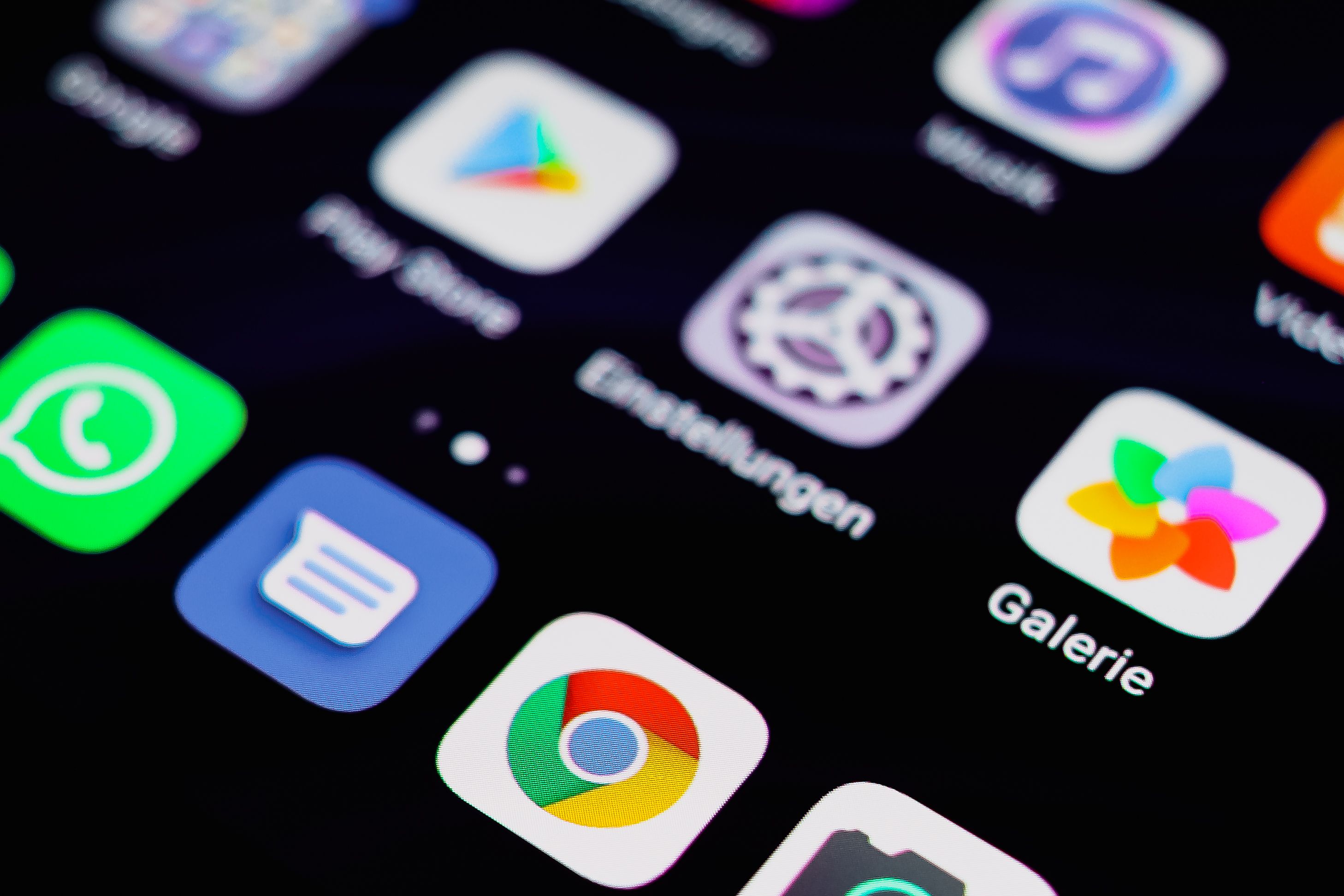 A smartphone screen displaying app store icons